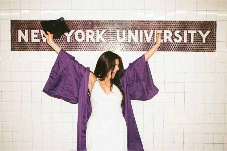 Graduate at NYU subway sign